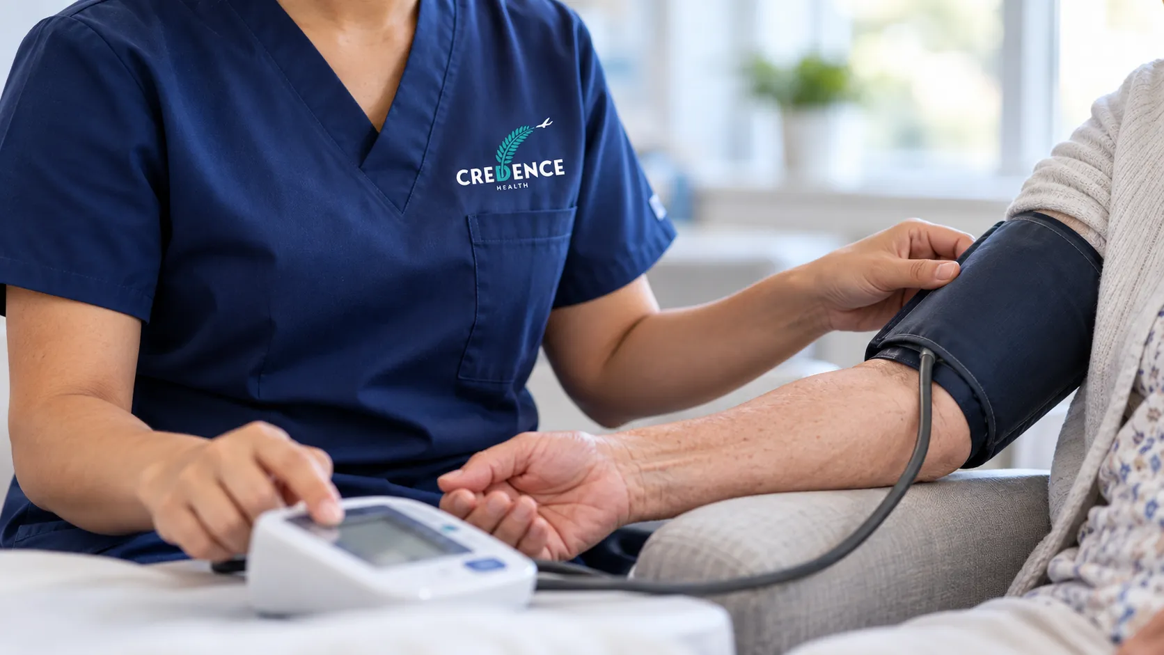 A nurse taking an older person's blood pressure